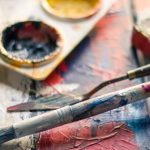 Hobby - Selective Focus Photography of Paintbrush Near Paint Pallet