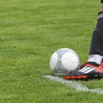Hobbies - Soccer Player Kicking White Gray Soccer Ball on Green Grass Field