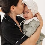 Co-Parenting - Young Mother Holding a Baby Girl