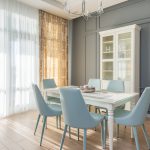 a-dining-table-with-chairs-near-the-white-cabinet